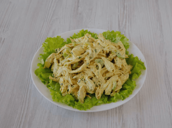 A fresh and vibrant cardamom chicken salad, with shredded chicken meat, over bed of green lettuce