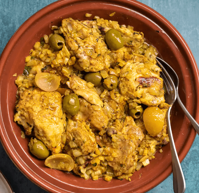 Traditional Moroccan chicken tagine with saffron and olives.